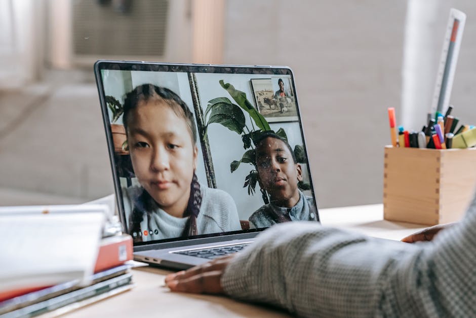 Children participating in a virtual learning session on a laptop